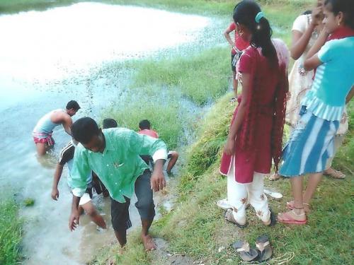 NSS Volunteers engaged in cleaning village pond